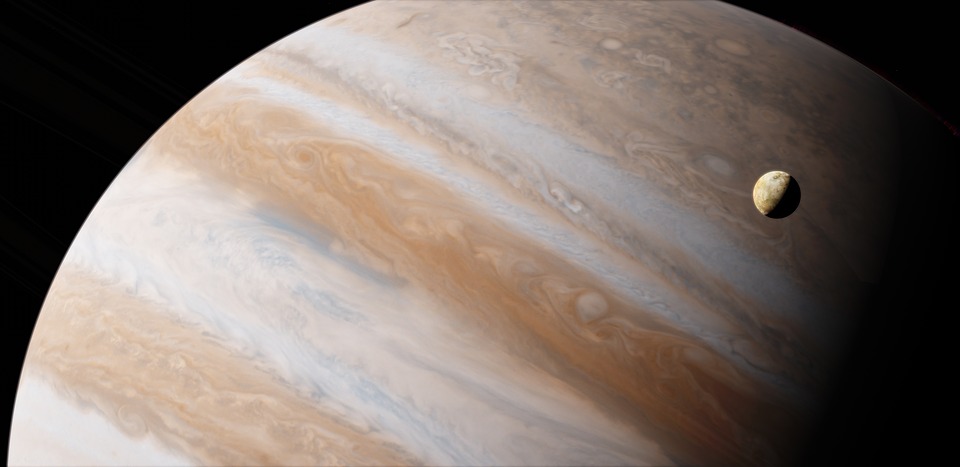 Planeten Jupiter med en måne som roterar runt den